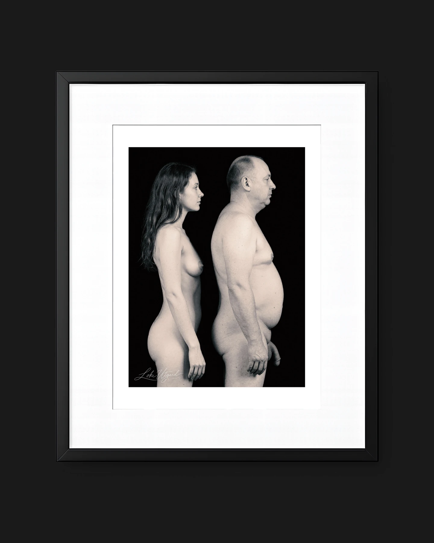 Framed collector edition titled GenXYC, showing two figures in side profile against black