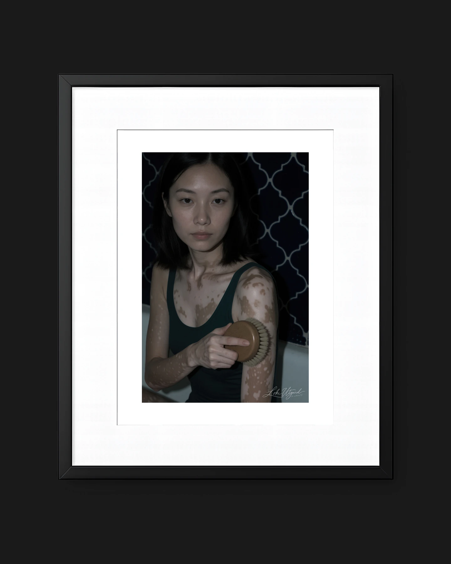 Framed collector edition titled What Am I?, showing a seated woman brushing her arm